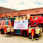 Feuerwehrbeschäftigte in Herzogenrath mit Transparent "Hände weg von unserer Altersgrenze!"