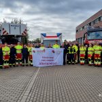 Feuerwehrbeschäftigte in Dorsten mit Transparent "Hände weg von unserer Altersgrenze!"